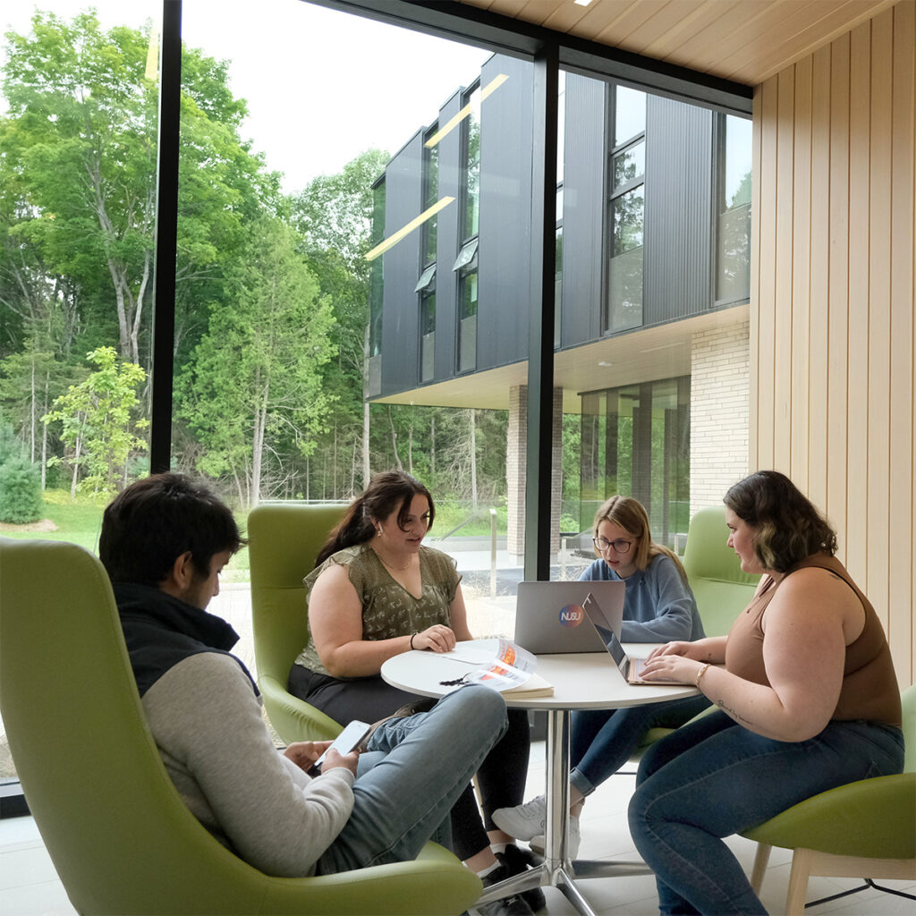 A group of students doing work in the student centre