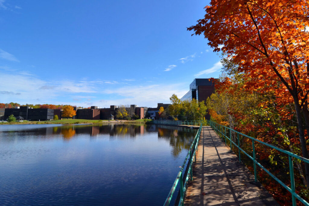 Fall view of Nipissing building from the pond